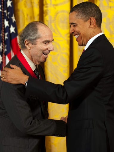 President Obama (right) presents the National Humanities
