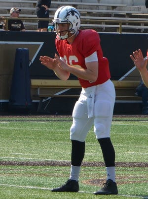 Western Michigan quarterback Jon Wassink (16).