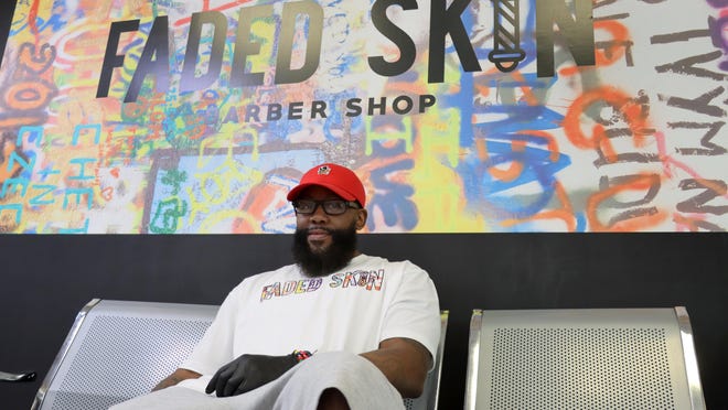 Malik Williams, the owner of Faded Skin Barbershop. The business is located in the Food Court at Westgate Mall.