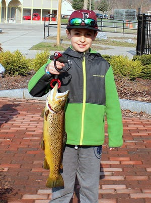 Kasin Shoemaker captured first place in the annual Trout Unlimited youth fishing derby on Eldridge Lake with this lunker brown trout.