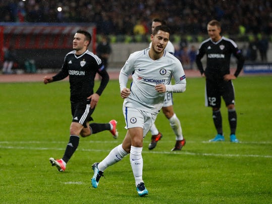 Chelsea's Eden Hazard celebrates after scoring the opening goal of the game from the penalty spot during their Champions League, group C, soccer match between Qarabag FK and Chelsea at the Baku Olympic stadium in Baku, Azerbaijan, Wednesday, Nov. 22, 2017. (AP Photo/Pavel Golovkin)