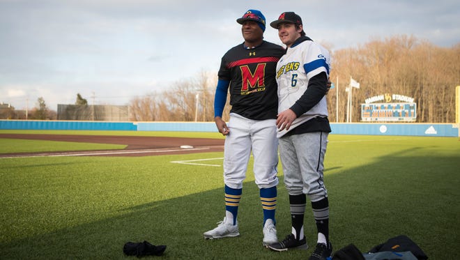 University of Maryland pitcher Billy Phillips trades jerseys with Delaware player and former St. Mark's teammate Calvin Scott for a photo after the two played against each other Tuesday, March 13, 2018 at Bob Hannah Stadium. 