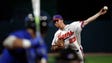 Clemson pitcher Charlie Barnes (23) throws to a Duke