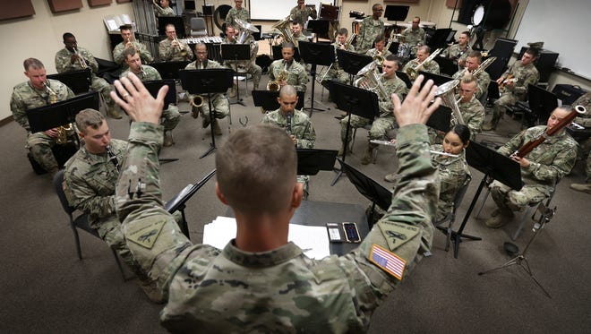 The 1st Armored Division Band, led by Capt. Joel DuBois, is preparing for its holiday concert Dec. 2.