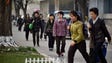 Pedestrians walk along a street in Pyongyang, North