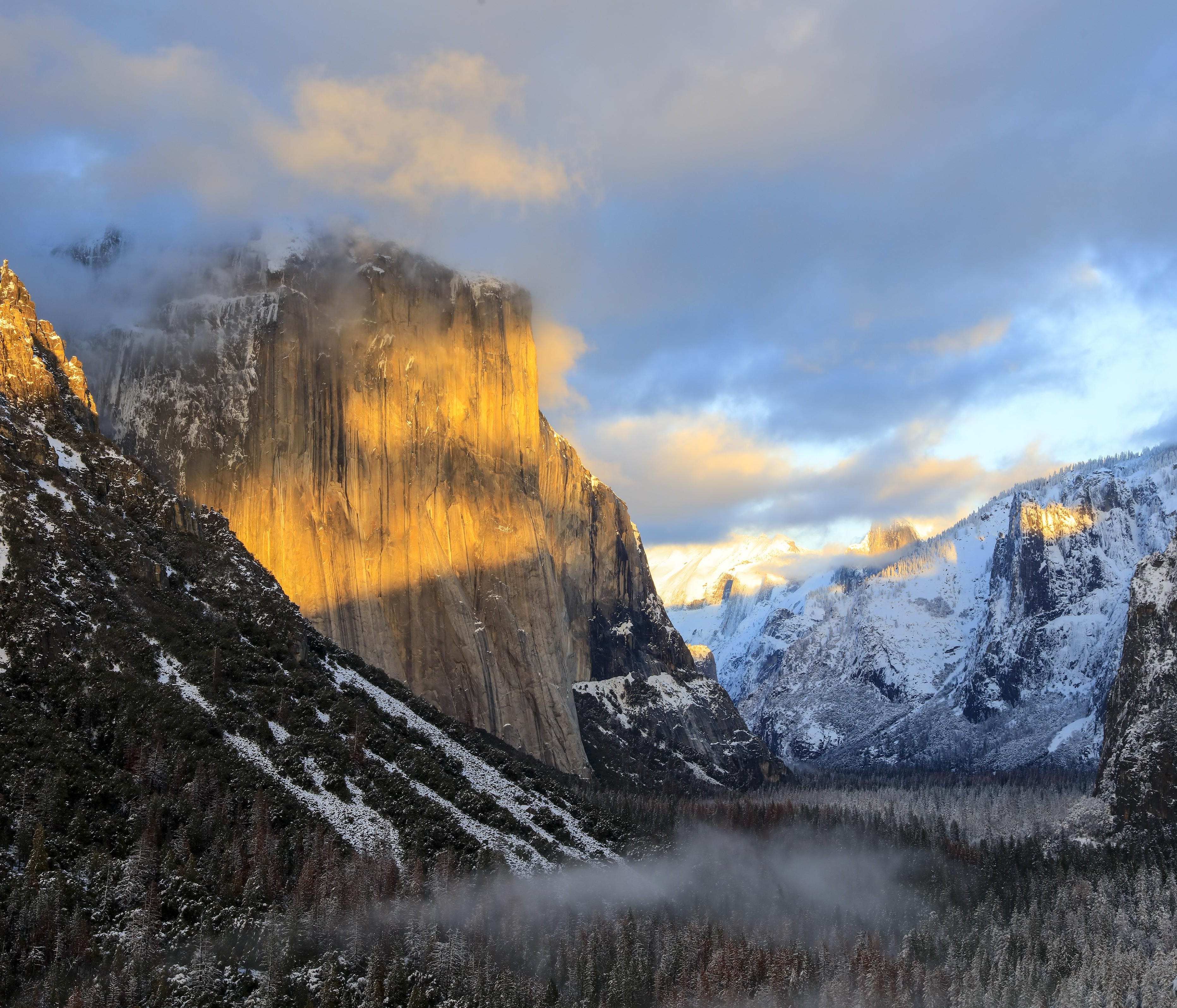 Sunset splashes the top of Yosemite's famous El Capitan with color on a January day. The 3,000-foot granite face is a favorite with rock climbers.
