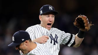 The Yankees' Todd Frazier celebrates with Greg Bird during the ALCS against the Houston Astros.