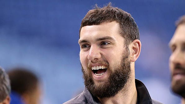 Indianapolis Colts quarterback Andrew Luck (12) shares a laugh with his teammates before the start of  their game. The Indianapolis Colts play the Houston Texans Sunday, December 20, 2015, afternoon at Lucas Oil Stadium.