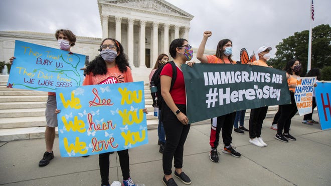 Deferred Action for Childhood Arrivals (DACA) students celebrate in front of the U.S. Supreme Court after the Supreme Court rejected President Donald Trump's bid to end legal protections for young immigrants.