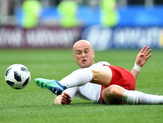 Poland defender Michal Pazdan goes for the ball against