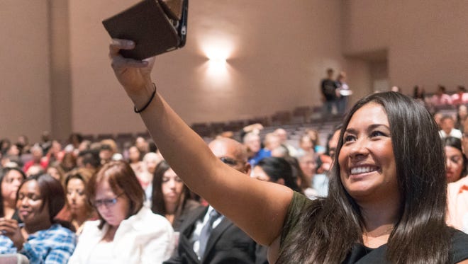 "Dreamer" Dulce Matuz takes a selfie at a naturalization ceremony at Trevor G. Browne High School in Phoenix on Sept. 19, 2016.