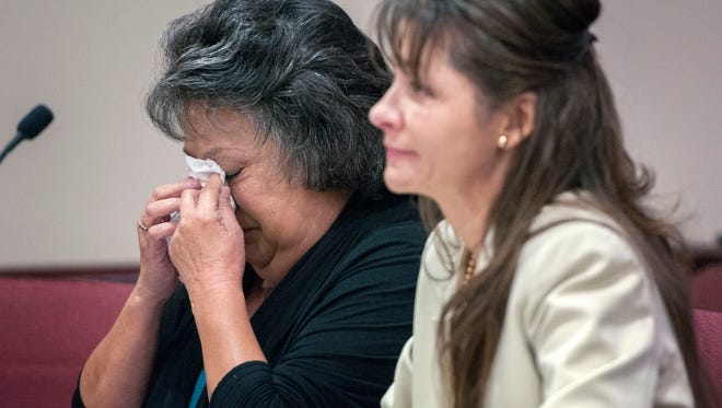 Former New Mexico Secretary of State Dianna Duran, left, reacts next her attorney, Erlinda Johnson, after speaking to the court during a sentencing hearing in Santa Fe.