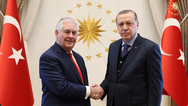 This handout photo taken and released by the Turkish Presidential Press Service on March 30, 2017 shows Turkish President Recep Tayyip Erdogan (right) attending a meeting with US Secretary of State Rex Tillerson (left) at the Presidential Complex in Ankara.