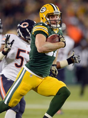 Green Bay Packers receiver Jordy Nelson (87) races to the end zone past the block of Randall Cobb (18) against the Chicago Bears during Sunday night's game at Lambeau Field.
