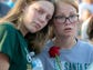 Students embrace during a vigil for victims of the