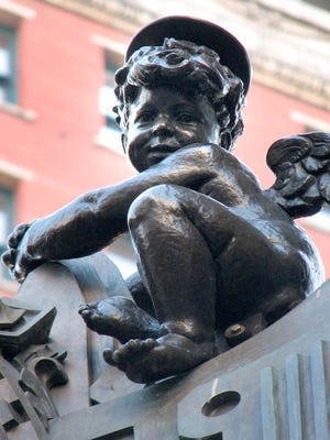 The holiday Cherub, a longtime Downtown Indianapolis tradition, resumed its perch on the side of the former L.S. Ayres building at the corner of Meridian and Washington streets.
