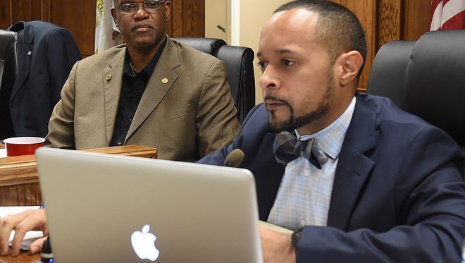 Opelousas City Attorney Travis Broussard discusses the city budget Tuesday while Mayor Reggie Tatum looks on. The Board of Aldermen voted to have another public discussion on Oct. 15, at Opelousas City Hall.