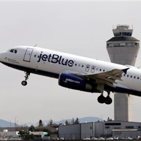 In this April 23, 2013, file photo, a JetBlue plan