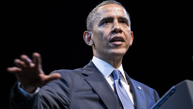 President Obama touts health  care in December 2013.