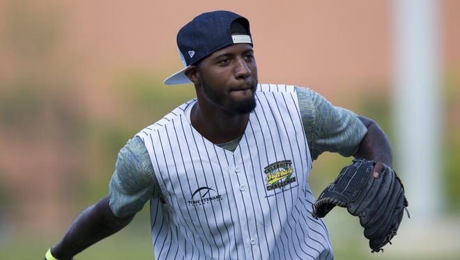 Paul George pitches during the Caroline Symmes Memorial Celebrity Softball Game at Victory Field benefiting the Symmes Cancer Endowment, Indianapolis, June 4, 2015.