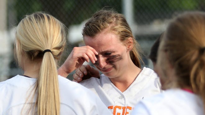 Scio players tear up after the Rainier vs. Scio softball game, in the semifinals of the OSAA Class 3A state playoffs, at Scio High School on Tuesday, May 31, 2016. Rainier won the game 6-4.