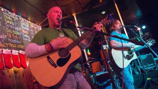 Jim Streisel and Donny Coyle play with The Dead Squirrels at Kip's Pub, Indianapolis, Jan. 10, 2015. Streisel teaches journalism at Carmel High School.