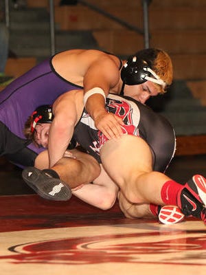 Hunterdon Central's Michael Iodice (bottom) wrestles Old Bridge's Chris Carpio at 182 pounds at the Central Group V semifinals on  Feb. 10, 2016.