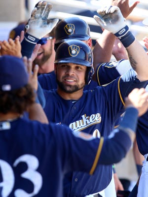 Brewers catcher Manny Piña, shown celebrating a three-run homer last week against the Chicago Cubs, hit his fourth home run of spring training on Friday against the Cincinnati Reds.