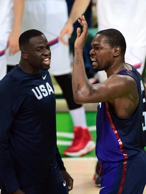 USA's Kevin Durant reacts with Draymond Green during the gold medal game between Serbia and USA in Rio de Janeiro on Aug. 21.