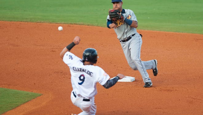 Sebastian Elizalde (9) slides into second as shortstop Junile Querecuto (1) turns the double play to end the bottom of the 1st inning during the Montgomery Biscuits vs. Blue Wahoos baseball game at Blue Wahoos Stadium in Pensacola, FL on Tuesday, June 14, 2016.