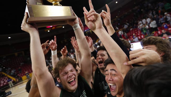 Sunnyslope players celebrate after beating Deer Valley to win the 5A Boys State Basketball Championship game at Wells Fargo Arena in Tempe, Ariz. February 27, 2018.