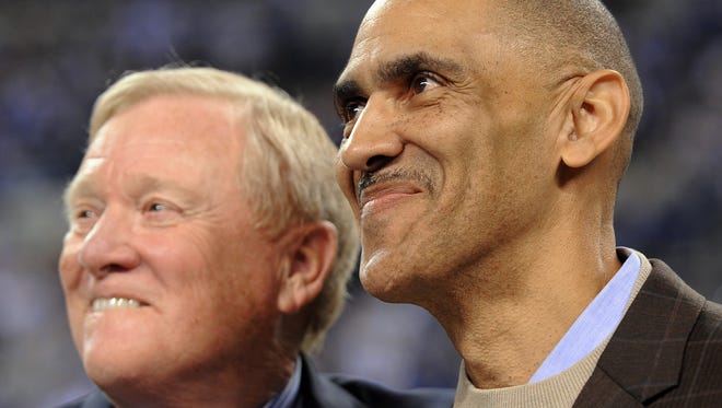 Former Colts coach Tony Dungy is all smiles as he watches a video tribute about himself with President Bill Polian inside the stadium during a ring of honor ceremony at halftime. The Indianapolis Colts host the Houston Texans at Lucas Oil Stadium Monday, Nov. 1 2010. (Matt Detrich / The Star)