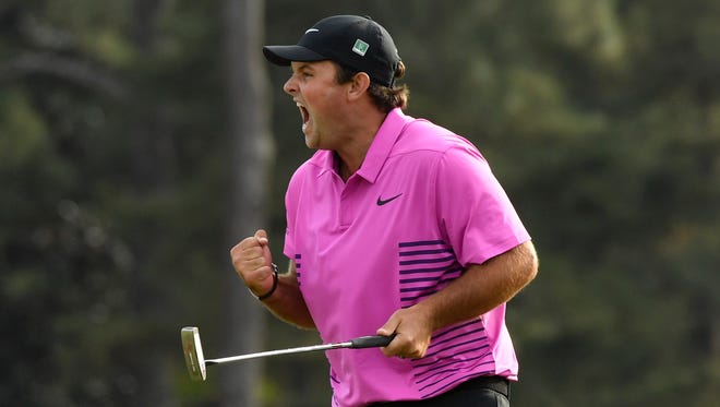 Apr 8, 2018; Augusta, GA, USA; Patrick Reed celebrates after making a putt on the 18th green to win the Masters golf tournament at Augusta National Golf Club. Mandatory Credit: Michael Madrid-USA TODAY Sports
