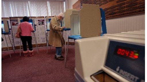 Voters cast ballots in a 2004 Rhode Island primary.
