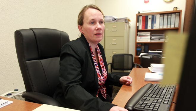 Covington finance director Lisa Goetz works in her office at City Hall.