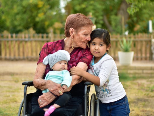 Altagracia Zamora with her grandchildren. Hospice of the Valley offers Spanish translation services.