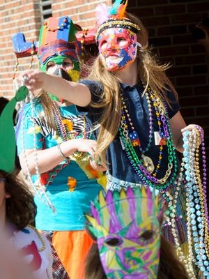 French Immersion students at Myrtle Place hold a Mardi Gras parade to raise money for a trip to Martinique. Friday, Feb. 24, 2017.