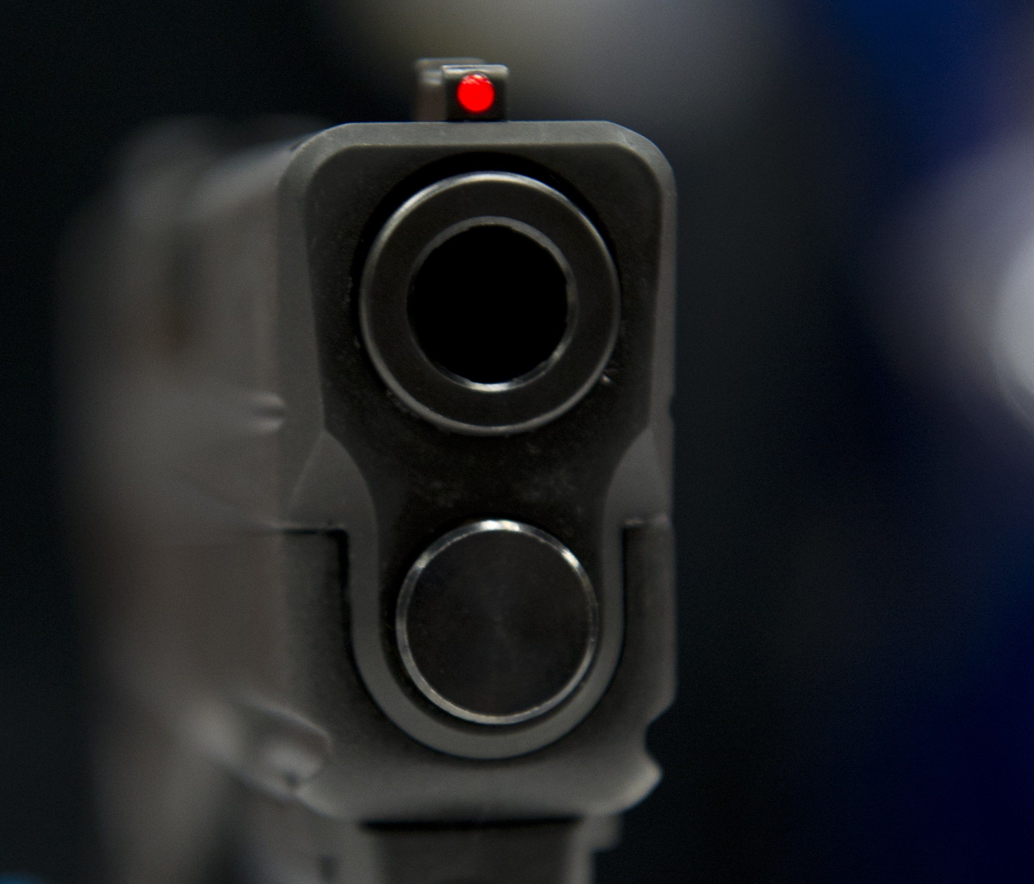 This file photo taken on April 25, 2014 shows a view down the barrel of a semi-automatic handgun.