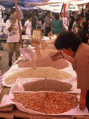 Dozens of varieties of dry beans vie for attention of shoppers at Puebla’s Zacatelco market.