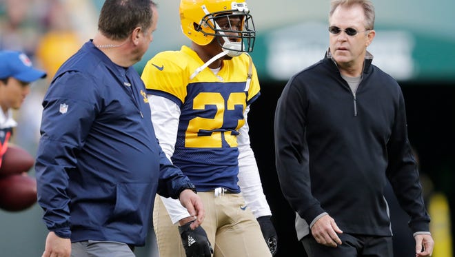 Green Bay Packers cornerback Damarious Randall leaves the field after getting injured against the Dallas Cowboys at Lambeau Field.
