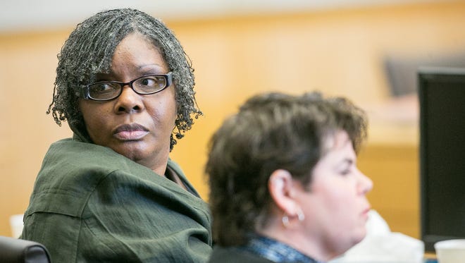 Jerice Hunter, accused of murdering her daughter, Jhessye Shockley, listens to opening arguments at her trial in Phoenix on Wednesday, March 25, 2015.