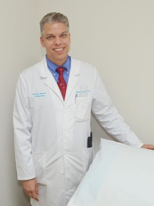Michael Spicer is a dermatologist with Brevard Medical Dermatology in Viera.