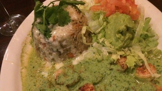 The Shrimp Cilantro platter comes with a mess of properly grilled shrimp dabbed in a bright, creamy green sauce, along with a timbale of cilantro-flecked rice and side of lettuce, tomato and dollop of guacamole.