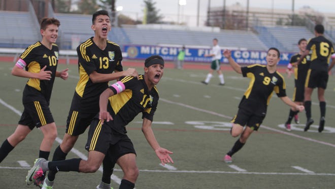 Hastings' Jackson Silverstein (11) celebrates with Diego Rodriguez (13) after scoring to put the Yellow Jackets up 3-0 during a New York State Class B regional final game between Hastings and Carle Place at Mitchell Field in Garden City on Saturday, Nov. 5th, 2016.