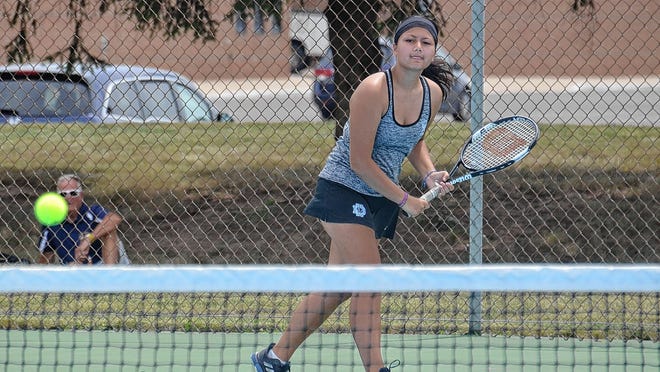 Chantrea Thip of the Darby girls tennis team volleys during a doubles match against Bradley on Aug. 12. Thip is one of 11 seniors for the Panthers and fourth-year coach Shawn Morris.