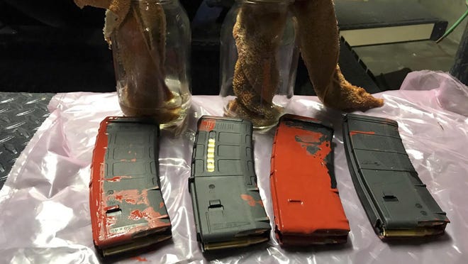 This photo posted Sunday, July 26, 2020, by the Portland Police Department on their Twitter page shows items the police say were loaded rifle magazines and Molotov cocktails found at a park in Portland, Oregon. A bag containing loaded rifle magazines and Molotov cocktails was found at Lownsdale Square Park near where protests have erupted for two months in Portland, following the death of George Floyd, police said. The photo of the items was shared in a tweet from police late Sunday saying someone pointed out the bag to officers at park late Sunday. No further information was immediately released.