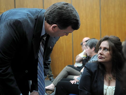 Deputy district attorney Elliott Sattler talks with