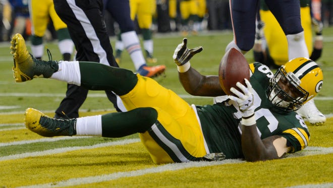 Green Bay Packers tight end Brandon Bostick catches a touchdown pass against the Chicago Bears at Lambeau Field.