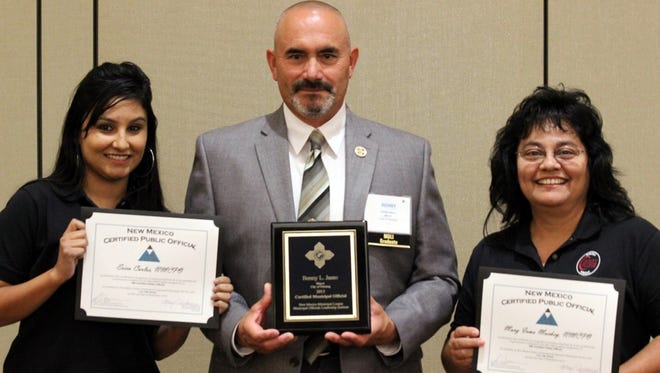 Courtesy Photo
From left, Erica Carlos, Mayor Benny Jasso and Mary Mackey display certificates they received at the New Mexico Municipal League Conference held Sept. 3, in Albuquerque.