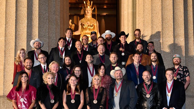 The  2017 class of CMA Awards Nominees pose for a photo at the Parthenon before a dinner to honor the 51st Annual CMA Awards Nominees prior the Awards on Wed., Nov. 8.Monday Oct. 30, 2017, in Nashville, TN